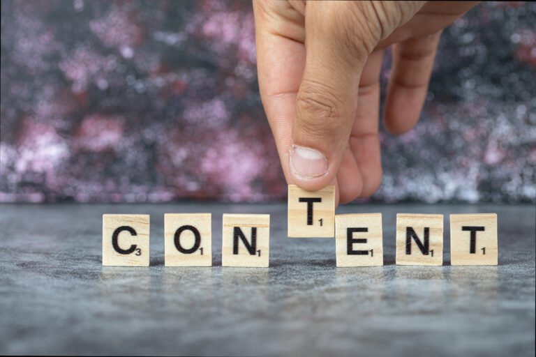 Content Writing With Black Letters Wooden Dices Blue Background High Quality Photo 768x512